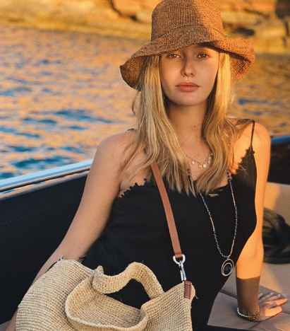 Kristina Romanova sun bathing. 